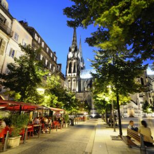 Restaurants at a square in front of the cathedral in the evening, Clermont Ferrand, Auvergne, France, Europe